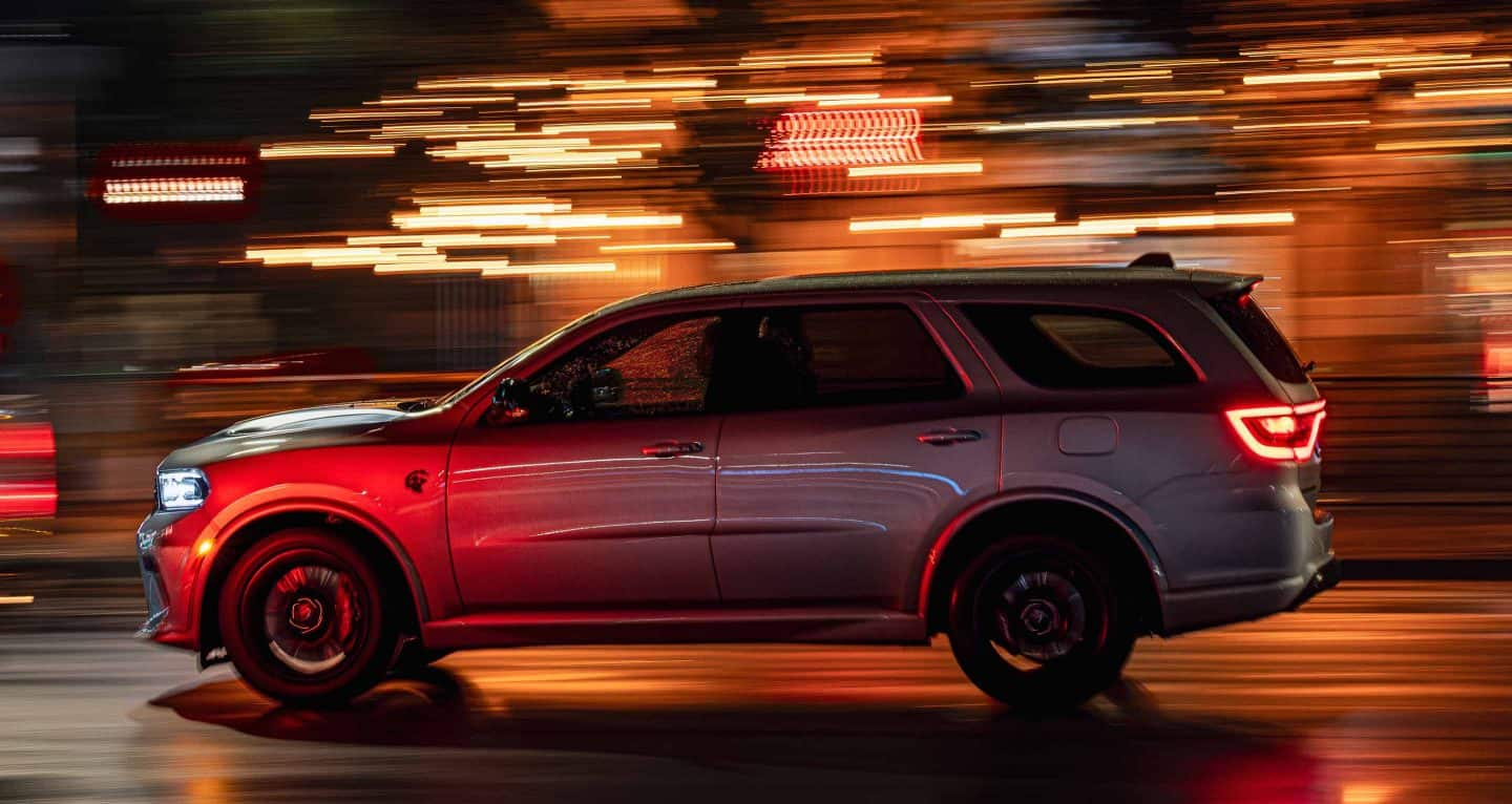 Display A driver-side profile of a silver 2025 Dodge Durango SRT Hellcat Silver Bullet Special Edition.