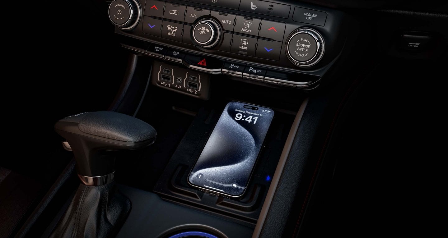 Display A smartphone on the charging pad in the center console of a 2025 Dodge Durango.